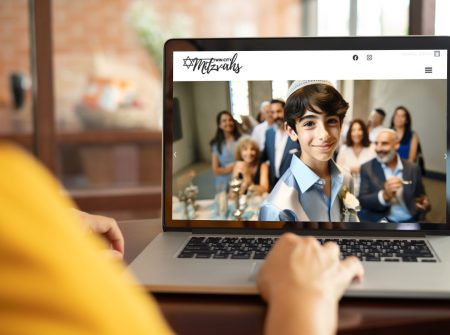 women using laptop computer working at home with blank white desktop screen.